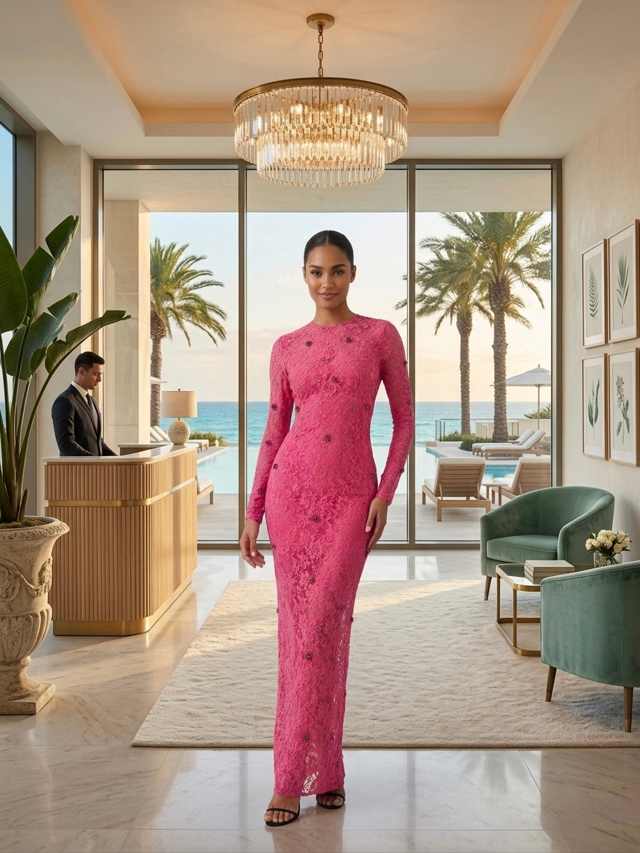Woman wearing the Rose Allure Lace Maxi in vibrant hot pink lace with delicate beaded embellishments, featuring a sculpted silhouette for an elegant evening look.