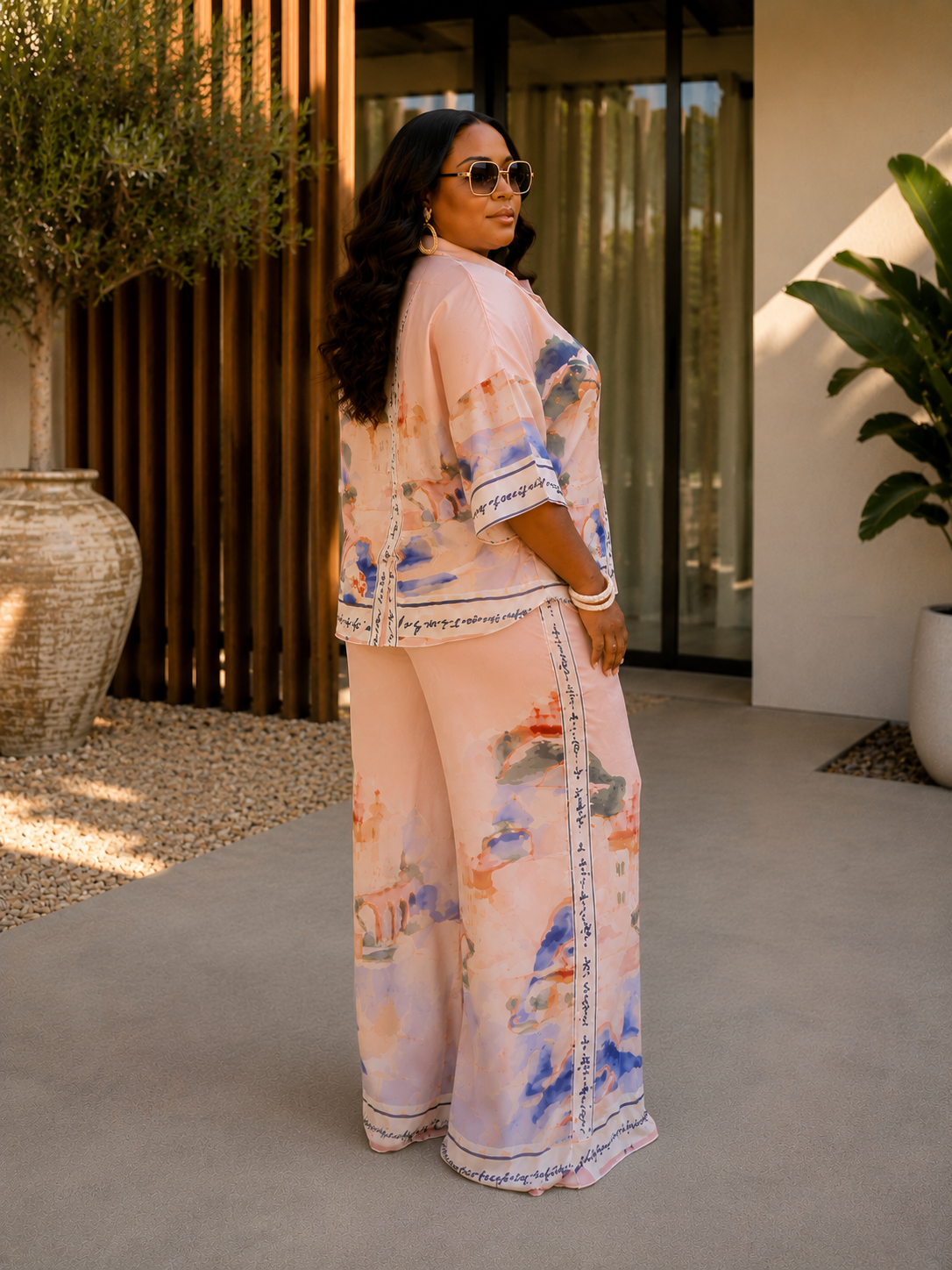 Woman wearing Capri Garden Set with flowing silhouette and soft floral print in lightweight fabric